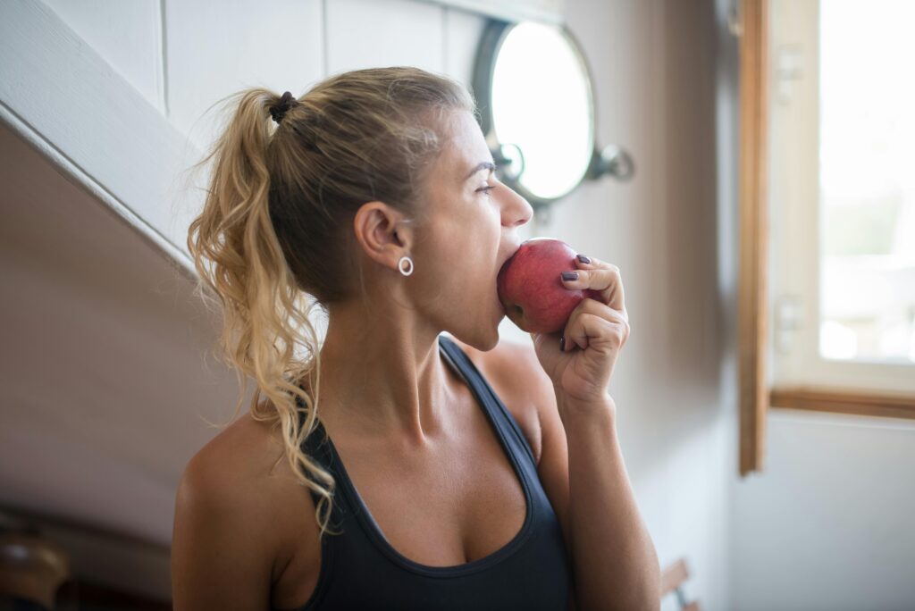 A woman eating an apple